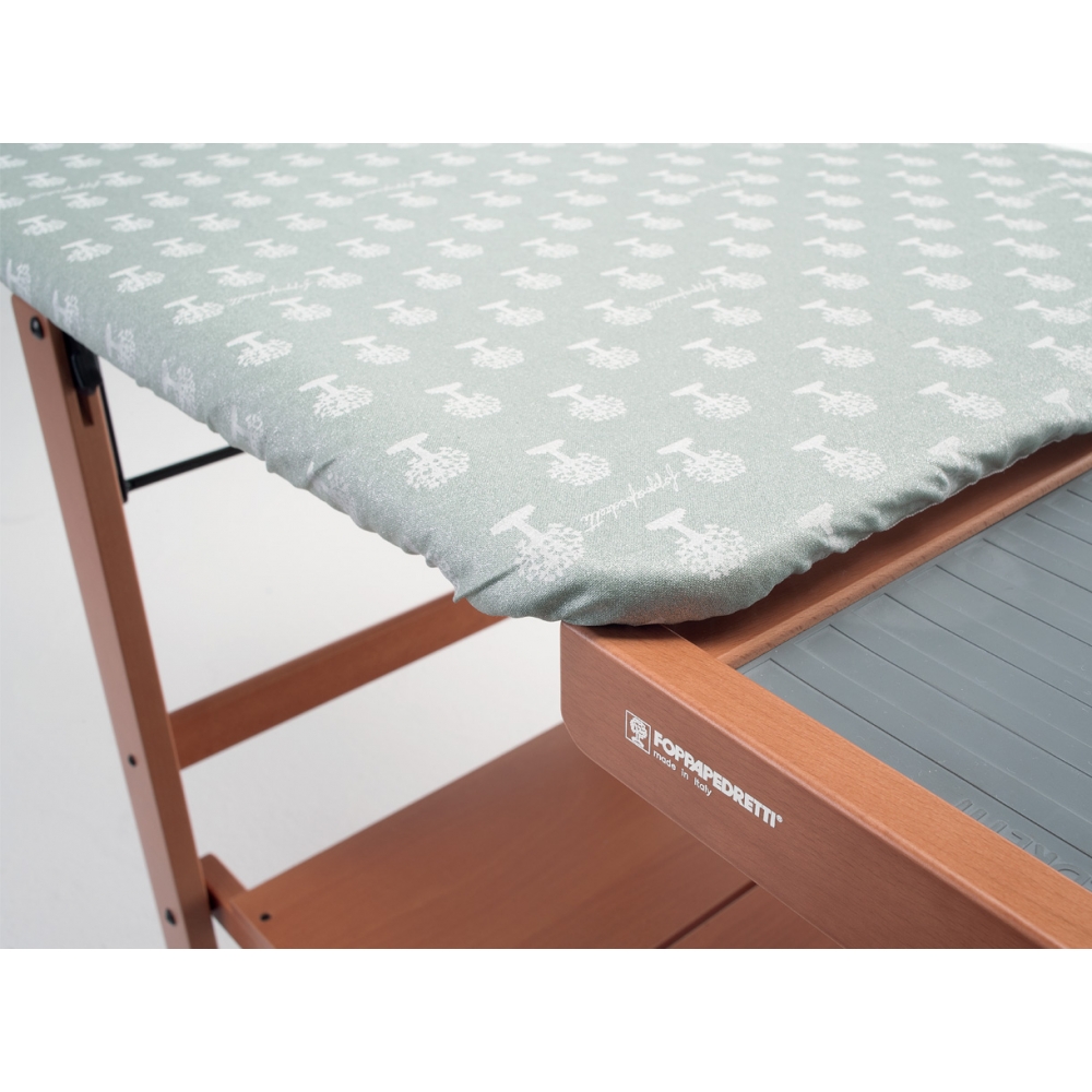 Breathable ironing board with housing for iron